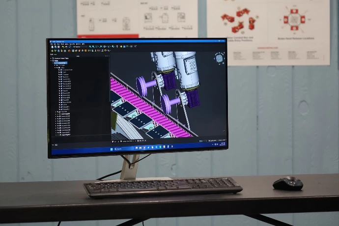Desktop Computer Displaying CAD design concept of Custom Machine 